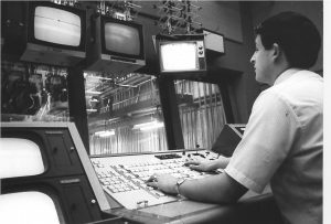 Old BECA Student at board in control room